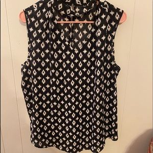 Super cute tank top ! Cut out v neck with strap that adds style !